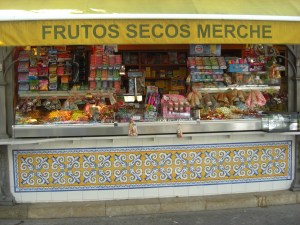 A stand outside the Cental market that specializes in a variety of nuts.