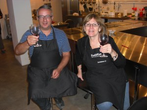 Susan and Pepe hoisting a glass of El Miracle red